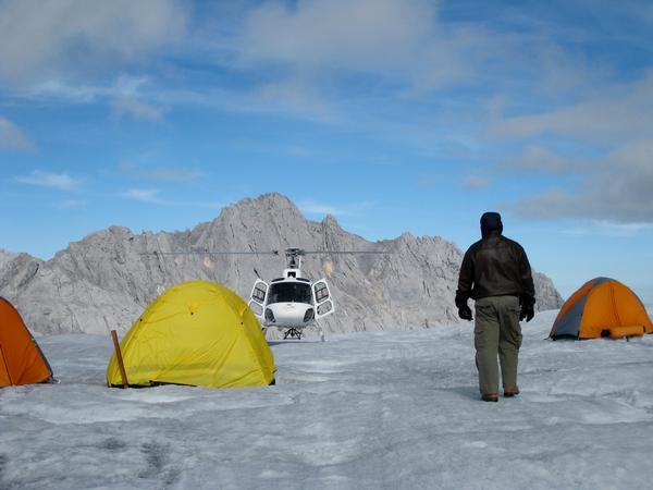 Mineserve sampling station on glacier Kershaw B3 Helicopter in background